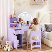 Child sitting at the purple vanity table with the LED mirror lit up