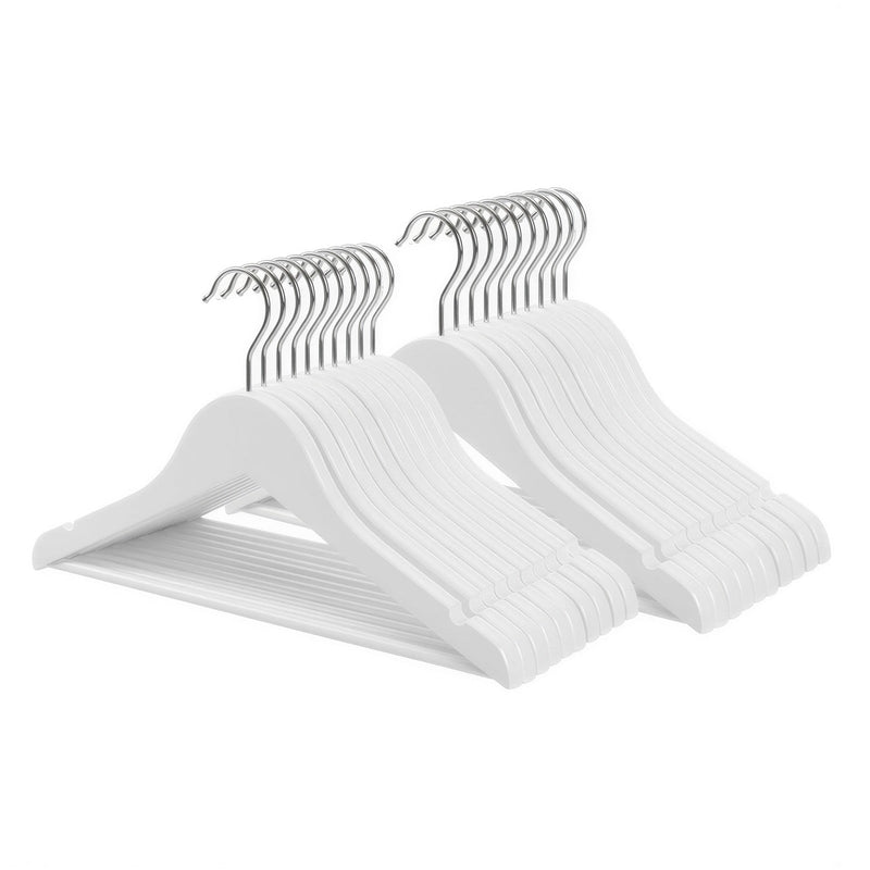 Stack of white wooden kids clothes hangers with trouser bars