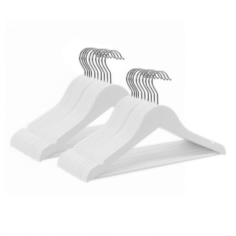 Two stacks of white kids wooden hangers arranged in a fan shape