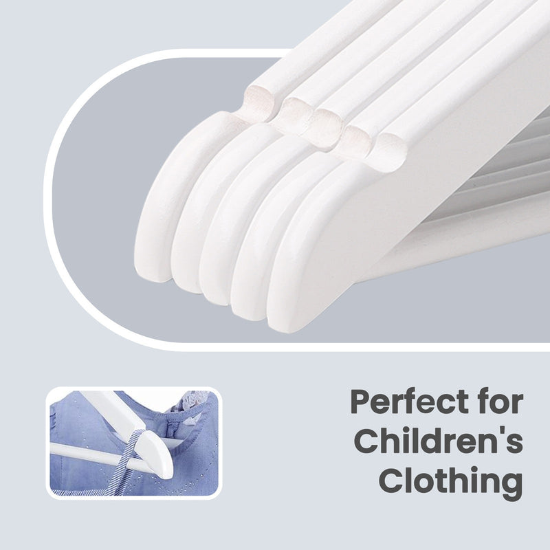 Kids hangers holding childrens clothing on a wardrobe rail
