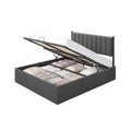 Slate grey king ottoman bed frame with the storage base lifted open to show fabric boxes