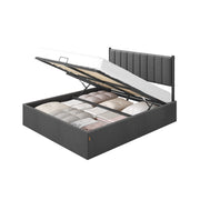 Slate grey king ottoman bed frame with the storage base lifted open to show fabric boxes