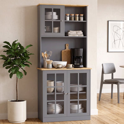Grey kitchen buffet hutch styled in a dining room with a coffee maker and crockery on the countertop