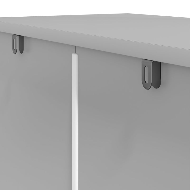 Close-up of the top edge and anti-tip brackets on the grey pantry cabinet
