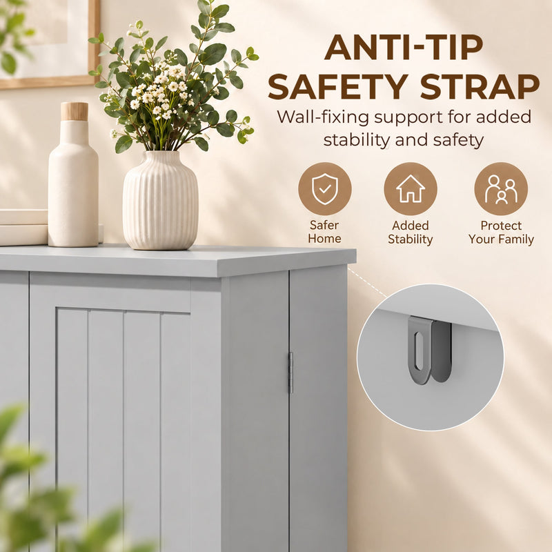 Anti-tip safety strap bracket on the grey pantry cabinet beside a vase of flowers