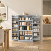 Open grey pantry cabinet stocked with jars and boxes beside a dining table