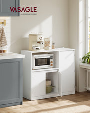 Vasagle kitchen sideboard styled against a kitchen window with pans stored inside the open cabinet door