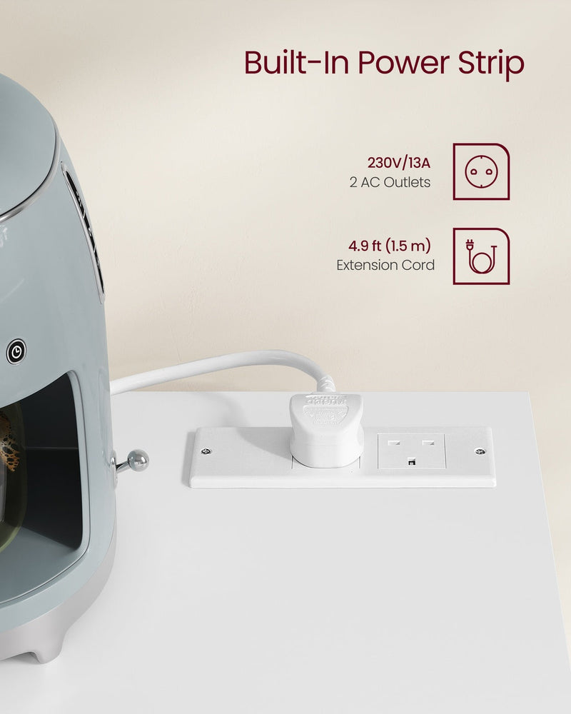 Close-up of the sideboard worktop's built-in power strip with two UK outlets and a coffee machine plugged in