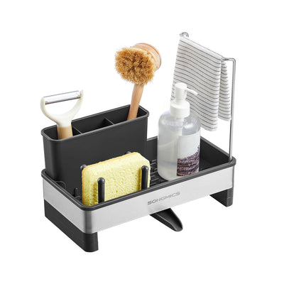 Songmics stainless steel kitchen sink caddy in ink black, studio shot with brush, sponge, and soap dispenser