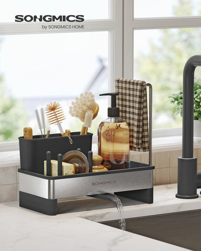 Ink black sink caddy styled on a kitchen countertop beside a running tap with brushes and soap