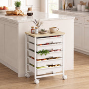 Trolley beside a marble kitchen island with fruit and vegetables in its drawers