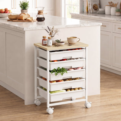 Trolley beside a marble kitchen island with fruit and vegetables in its drawers