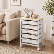 Trolley used beside a sofa in a living room storing books and craft supplies