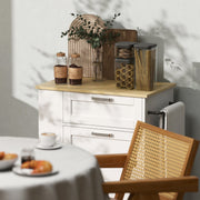 White kitchen trolley styled in a dining area beside a rattan chair and breakfast table