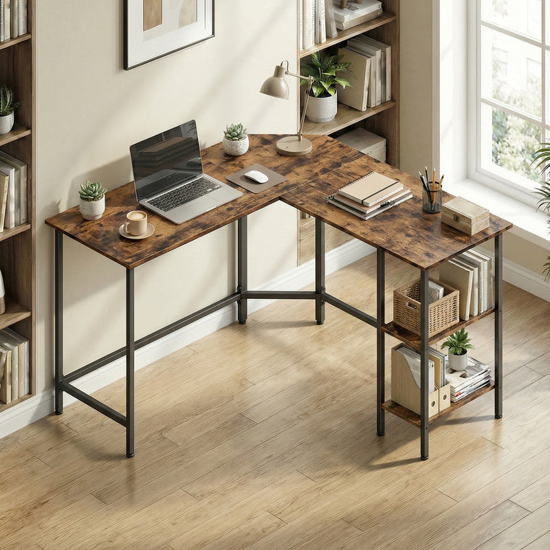 L-shaped desk in a home office corner beside a bookcase, holding a laptop, desk lamp and files on the shelves