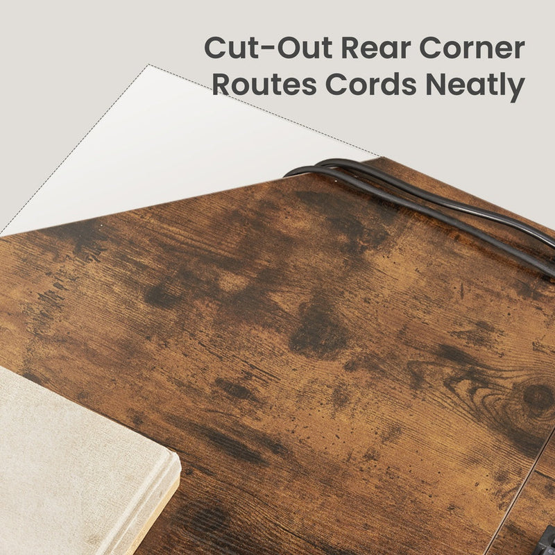 Close-up of the cut-out rear corner of the desktop with cables routed neatly through the gap