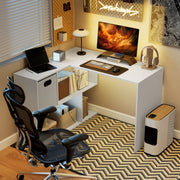 Corner desk set up as a gaming station with a monitor, mesh office chair and headphones