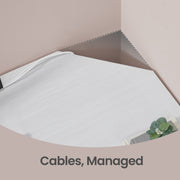 Close-up of the corner cable gap with a lead passing through the tabletop