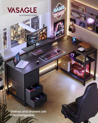 Ebony black L-shaped desk in a room setup with a monitor on the stand and two drawers pulled open