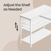 White corner desk with laptop and accessories on the worktop