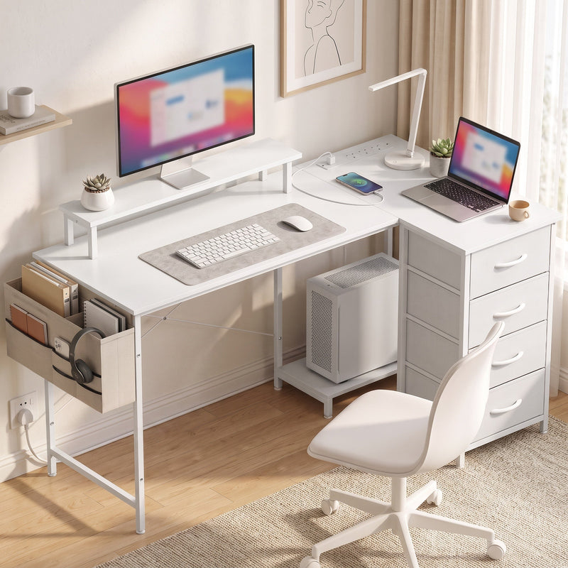 L-shaped desk in a home office with monitor, laptop and desk chair