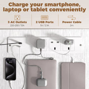 Close-up of the built-in power strip with 3 AC outlets, 2 USB ports and cable