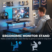 Man gaming at the desk with a 15.5 cm monitor stand raising the screen to eye level