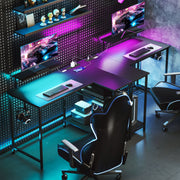 Reversed L shaped gaming desk with purple LED lighting and two monitors