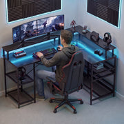 Man gaming at the L shaped desk with dual curved monitors in a white room