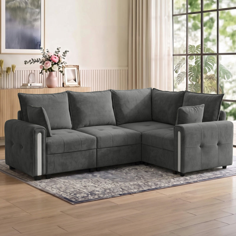 Dark grey L shaped sofa in a bright living room on a patterned rug