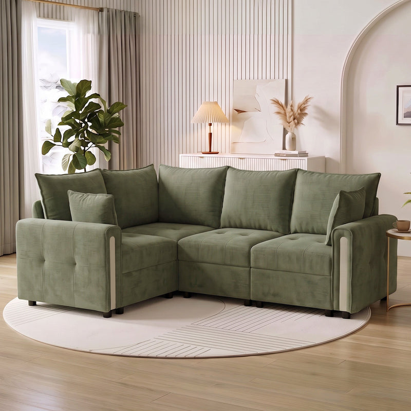 Dark green L-shaped sofa in a living room with a round rug and side table