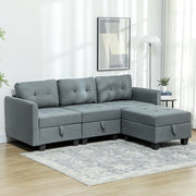 Dark grey modular sofa styled in a living room with a rug and floor lamp