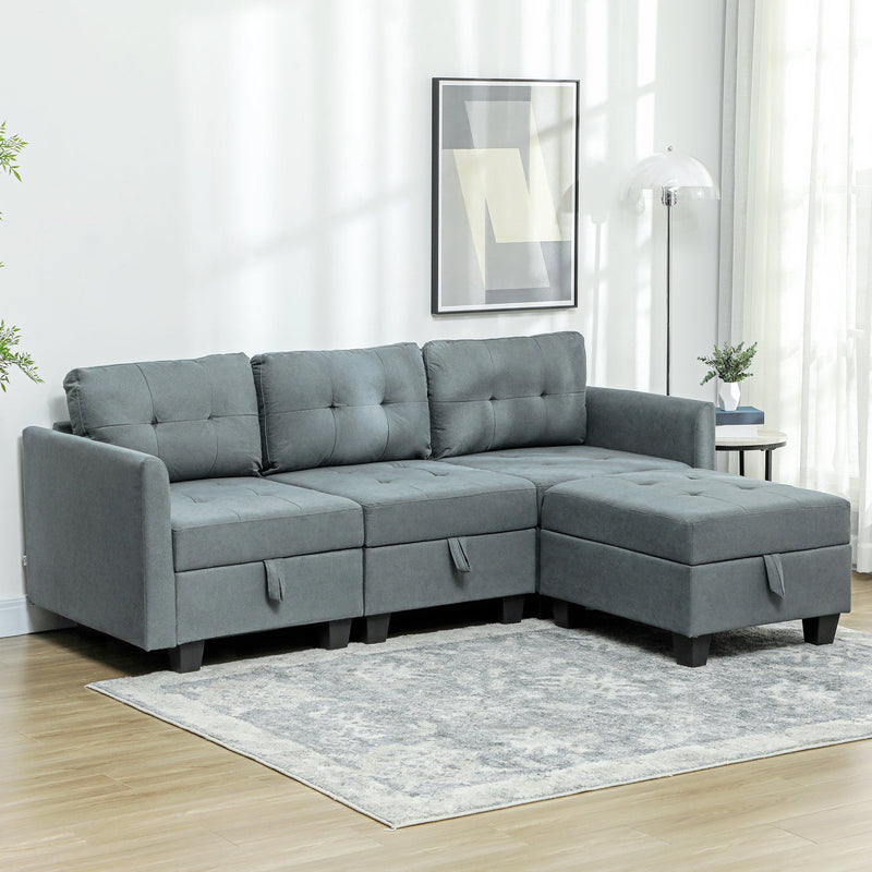 Dark grey modular sofa styled in a living room with a rug and floor lamp