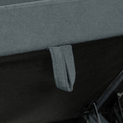 Close-up of the fabric pull tab used to lift open the module's storage lid