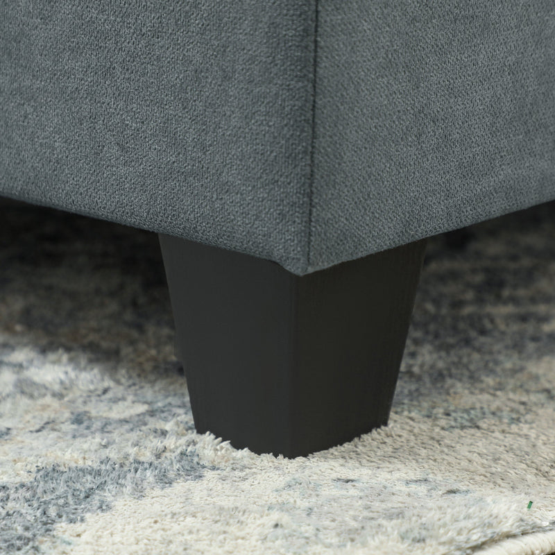 Close-up of the angled wood leg supporting one of the sofa modules