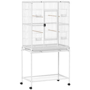 White large bird cage on a wheeled stand with a bottom shelf on a white background