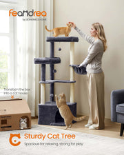 Cat resting inside the cave on the dark grey cat tree