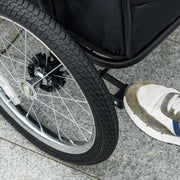 Large dog stroller wheel and brake close-up
