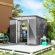 Grey metal shed on decking with the double doors slid open showing shelves of tools