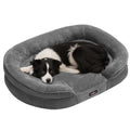Studio shot of a dog curled up in the Feandrea large orthopaedic dog sofa bed in Slate Grey