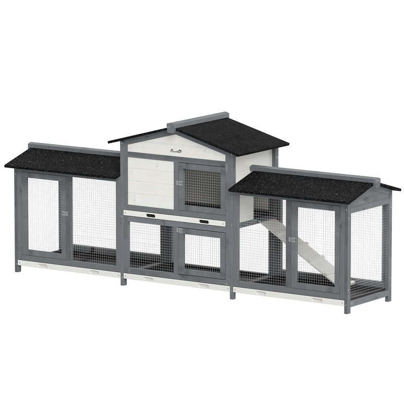 Grey and white rabbit hutch on a plain background with side run boxes and a black asphalt roof
