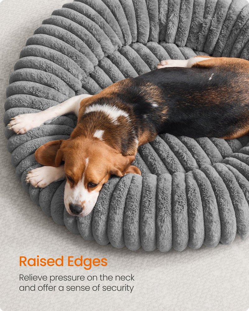 Close-up of a dog leaning against the raised rim edge of the Feandrea dove grey pet bed