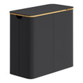 Ink black SONGMICS laundry hamper with bamboo rim and the lid closed, seen from the front corner