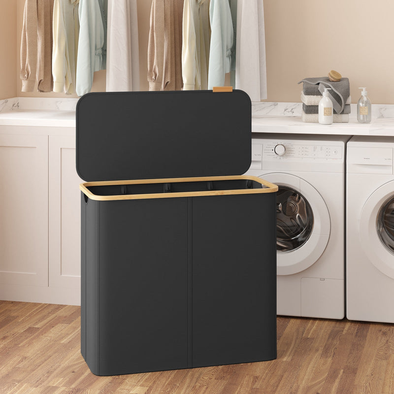 Hamper standing open in a utility room next to two white washing machines