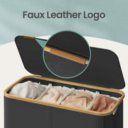 Close-up of the bamboo handle bar on the open hamper lid above the 4 loaded sections