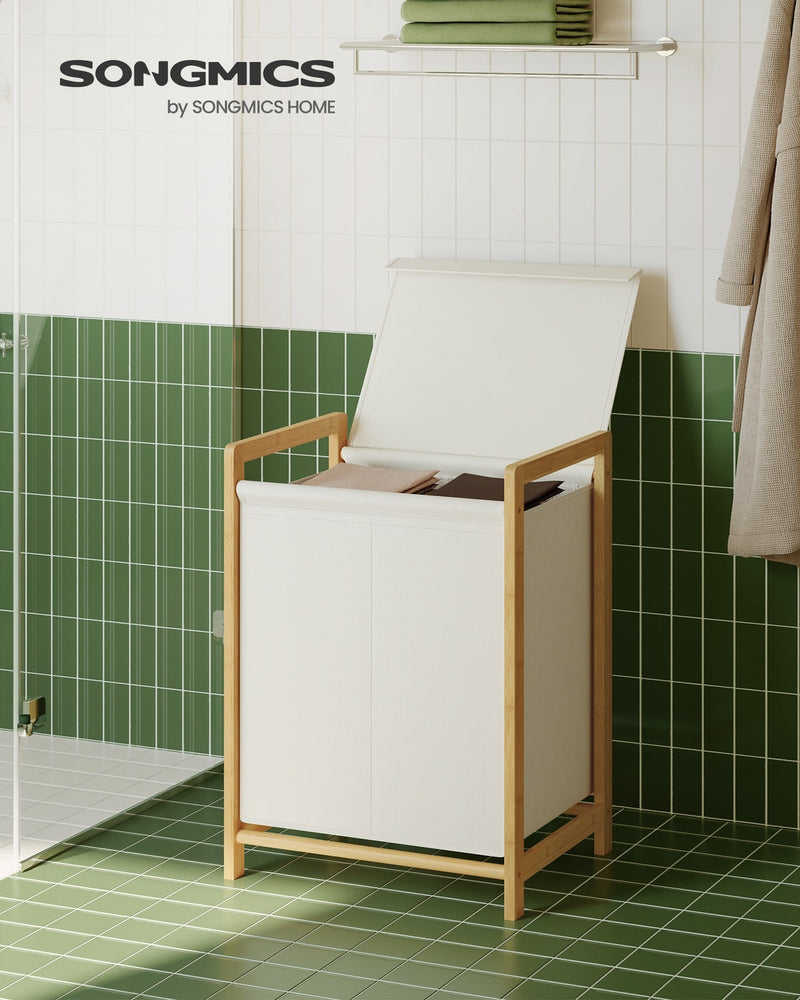 Cream white bamboo laundry hamper with lid open, styled in a bathroom