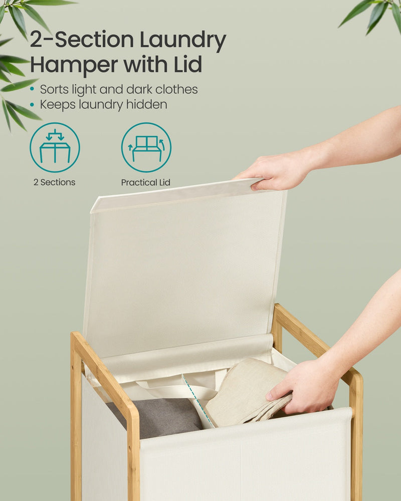 Close-up of the 2-compartment laundry hamper with lid open showing sorted light and dark clothes