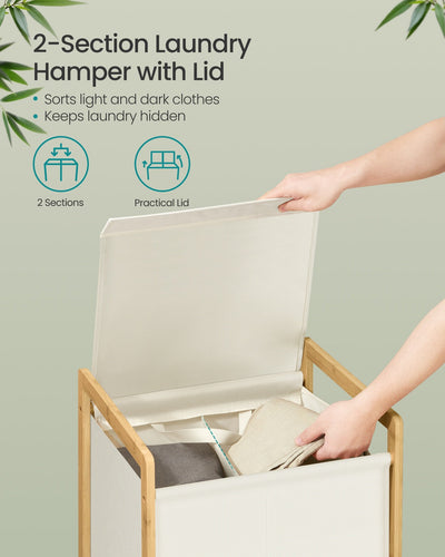 Close-up of the 2-compartment laundry hamper with lid open showing sorted light and dark clothes