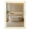 Songmics LED bathroom mirror illuminated above a freestanding bathtub in a modern bathroom