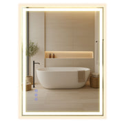 Songmics LED bathroom mirror illuminated above a freestanding bathtub in a modern bathroom